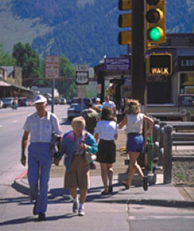 Older couple crossing the street