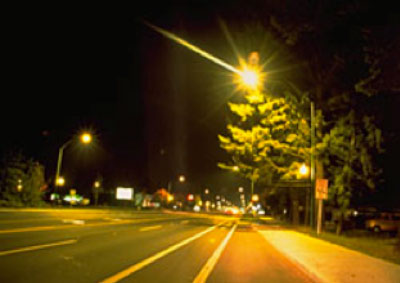 Streetlight illuminating dark road