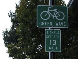 Signs explaining Valencia Streets green wave.