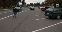 Traditional diagonal parking with 12-foot buffer lane, no bike lanes and incomplete sidewalks