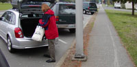 Driver unloading at the curb.