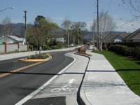 Raised bike lane and other traffic calming features utilized on Ayres Road.