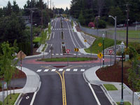 Redesigned Grandview Drive with roundabout, bike lanes, crosswalks, curb and sidewalk with buffer strips and enhanced lighting.