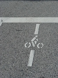 A symbol may be placed on the pavement indicating the optimum position for a bicyclist to actuate the signal. 