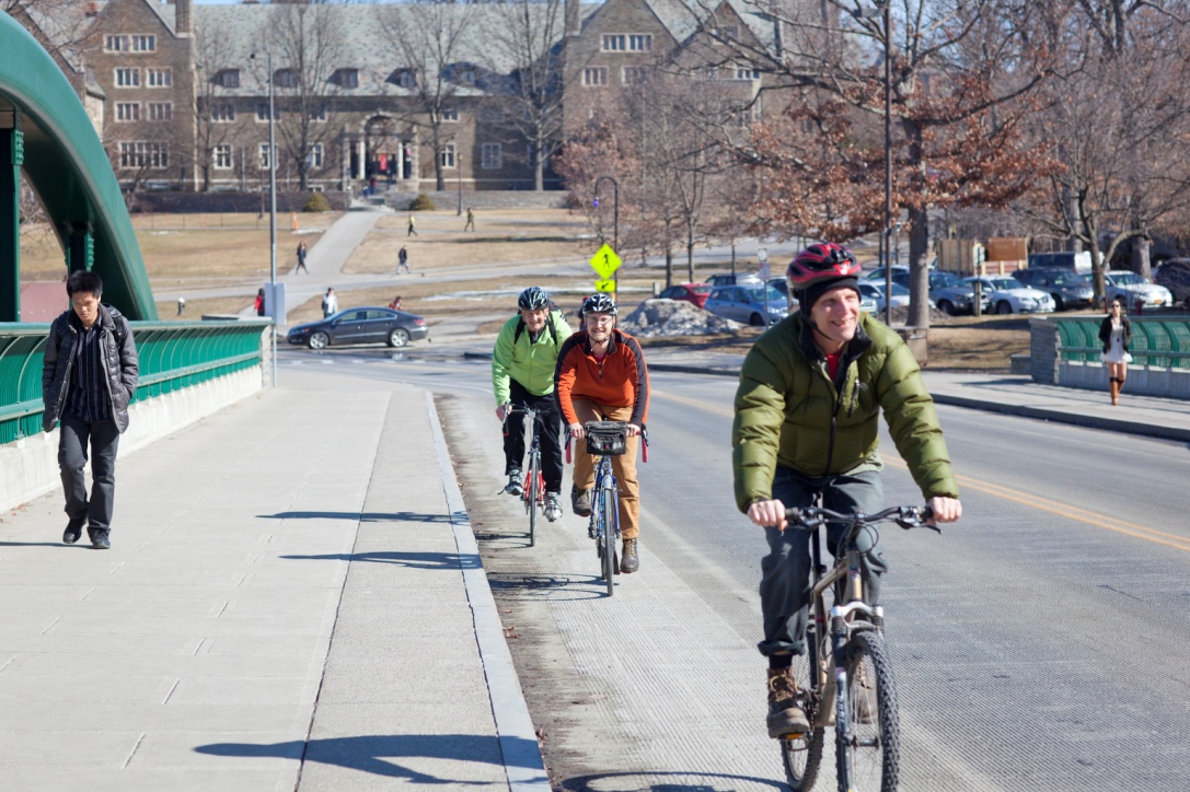 A group of bicyclists using the widened bridge.