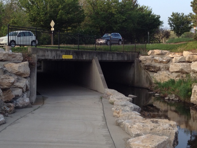 A grade-separated road crossing added to an existing culvert.