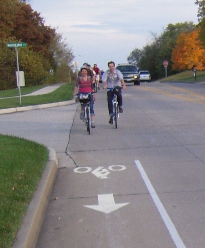 Bicyclists use one of the bike lanes.